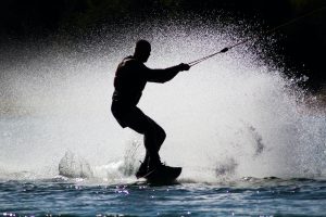 silhouette of man kite boarding